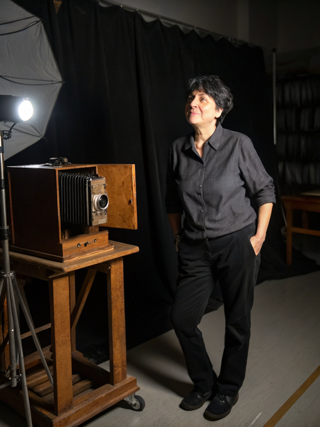 Black and white portrait with deep shadows and grain